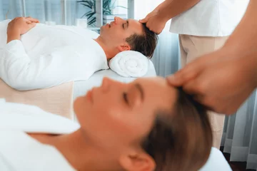Foto auf Alu-Dibond Caucasian couple enjoying relaxing anti-stress head massage and pampering facial beauty skin recreation leisure in dayspa modern light ambient at luxury resort or hotel spa salon. Quiescent © Summit Art Creations
