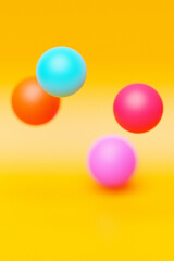 3d illustration of a   colorful  spheres on a  yellow   background. Digital metaball background of flying
