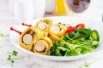 Ketogenic breakfast. Omelette with sausage. Sausage roll in omelette with lavash. Keto, ketogenic lunch. 