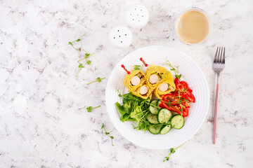 Ketogenic breakfast. Omelette with sausage. Sausage roll in omelette with lavash. Keto, ketogenic lunch. Top view