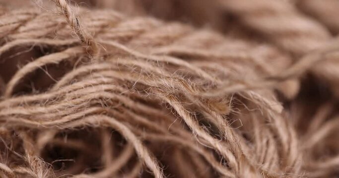 rough linen rope close-up, rough rope on a wooden table