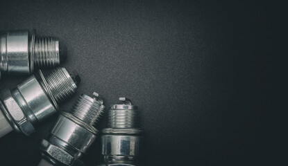 Spark plugs on gray gradient background