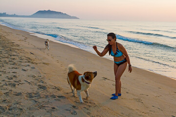 Woman body big with bikini and sunrise on beach