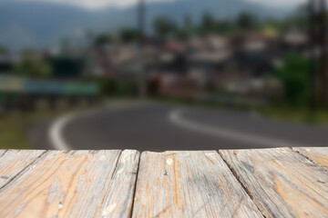 photo of a wooden board with a blurred street view in the background