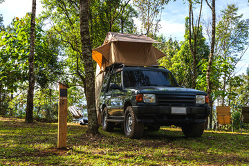 Camper car parking in camp site during weekend outdoors activity