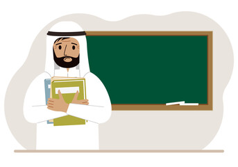 Male teacher with books on the background of the school board.