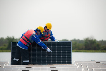 Photovoltaic engineers work on floating photovoltaics. Inspect and repair the solar panel equipment...