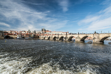 Fototapeta premium Karluv most bridge above Vltava river with Prazsky hrad castle in Praha city in Czech republic