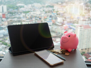 Save money and investment concept tablet living background