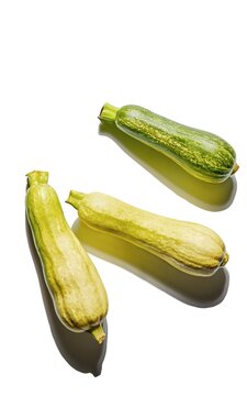 Fresh zucchini on a white background. Top view, flat lay
