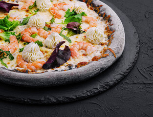 black pizza with shrimp and cream