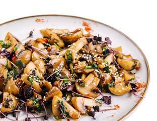 Warm salad with fried mushrooms isolated