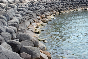 Rocky seascape, seashore in En Gev, Sea of Galilee, Israel - 733018354