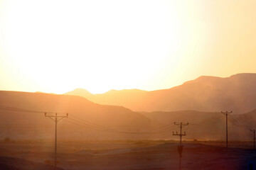 Sunset on the famous road number 90, which crosses Israel from north to south in the Jordan Valley,...
