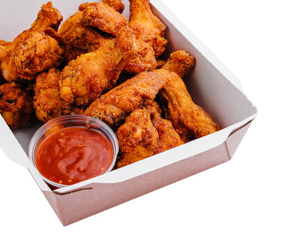 Takeaway box of crispy grilled chicken legs