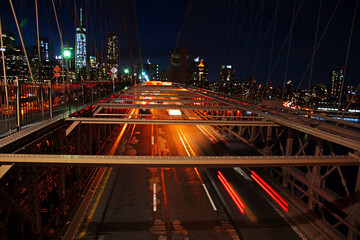 Night car traffic on Brooklyn Bridge in New York City