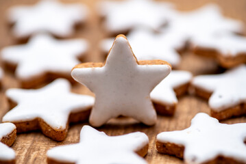 Cinnamon cookies in star shape and heart shape with white cinnamon icing