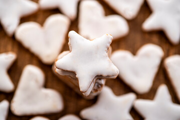 Cinnamon cookies for Christmas, in the shape of hearts and stars