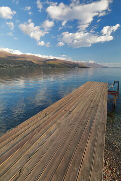 Wood plank boardwalk projecting from Potpesh beach towards Galicica mountain and the southeastern lakeshore. Ohrid-North Macedonia-331