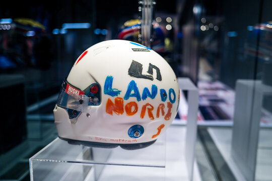 Silverstone, UK - August 13 2023 : Lando Norris' F1 helmet from the British Grand Prix hand drawn by a child on display at a museum