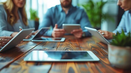 Actual Team Engagement: Business Professionals Gathering for Social Media and Startup Project Planning, Utilizing Tablets for Data Analysis