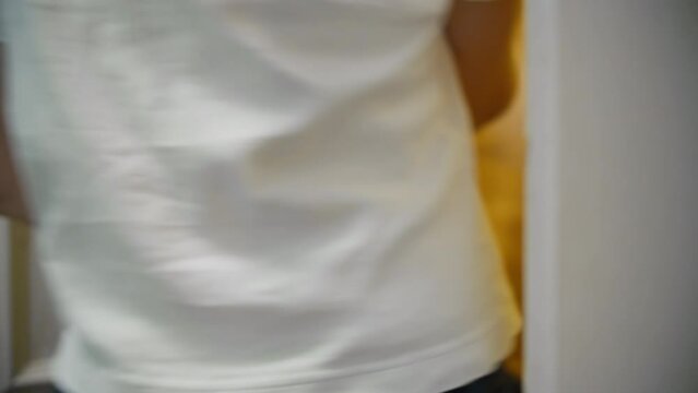 Close up of hand using keycard to unlock hotel door