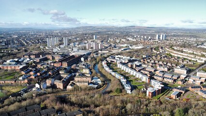 Aerial cityscape showcasing houses and a meandering river. Maryhill, Glasgow, Scotland