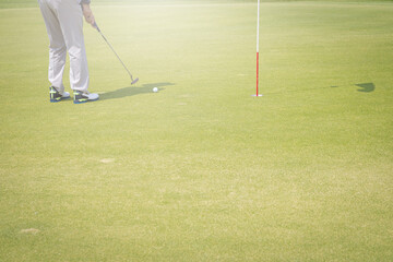 Obraz premium Golf ball hitting the hole in one shot of each hole