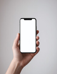 Hand holding a mobile phone with a blank screen