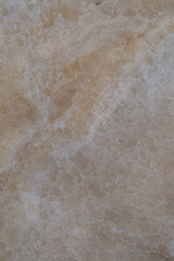A close-up photo of the cream-colored stone, showing the details of the stone