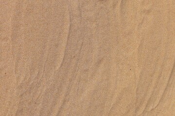 Obraz na płótnie Canvas Beach sand texture background. Beautiful sandy summer backdrop