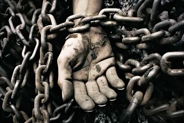 Foto op Plexiglas AI generated illustration of dirty hands holding chains on the ground © Wirestock
