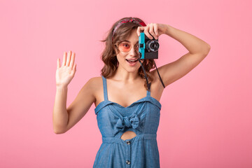 attractive smiling happy woman posing with vintage photo camera