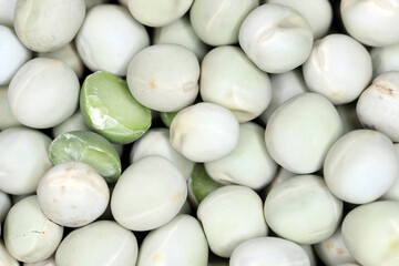 Green sweet peas. Whole and broken seeds.