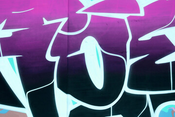 Colorful background of graffiti painting artwork with bright aerosol outlines on wall. Old school...