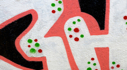 Colorful background of graffiti painting artwork with bright aerosol outlines on wall. Old school street art piece made with aerosol spray paint cans. Contemporary youth culture backdrop