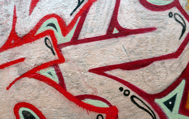 Colorful background of graffiti painting artwork with bright aerosol outlines on wall. Old school...