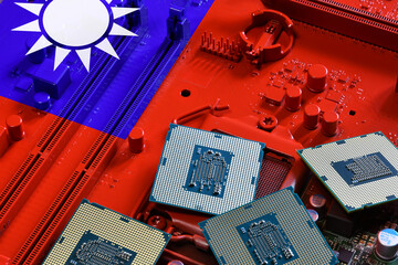 Flag of Taiwan on a red painted PC motherboard with some processors on it. Concept for supremacy in...