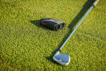 Golf , green grass, binoculars for golf observing, Laser Rangefinder, golfer stick. 