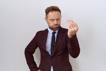 Middle age business man with beard wearing suit and tie doing italian gesture with hand and fingers confident expression