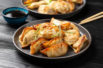 Crispy fried dumplings Gyoza with vegetables. Asian food.