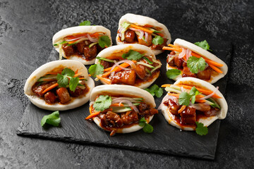Bao buns with pork belly and vegetable. Asian cuisine