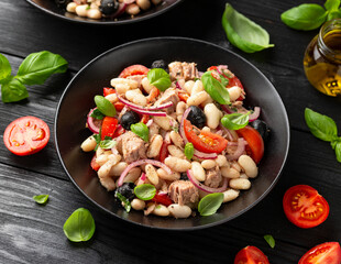 White bean tuna salad with olive, red onion, tomatoes. Healthy food