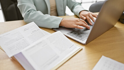 Young beautiful hispanic woman business worker using laptop working at the office