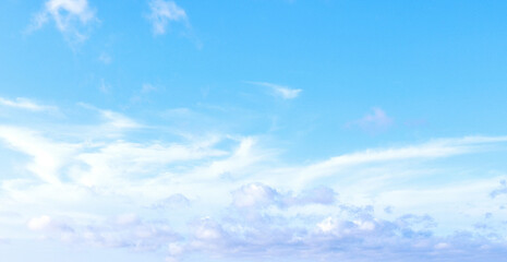 Blue sky with fancy clouds, panoramic photo.