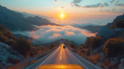 Fotobehang Psaka, Epirus, Greece, sunrise view of vehicles on a highway with low clouds and fog. © Zaleman
