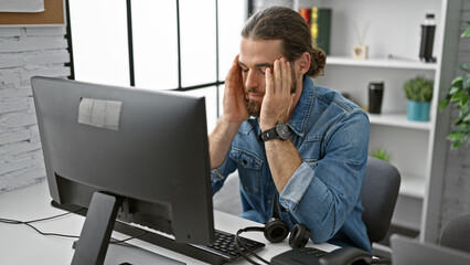 Young hispanic man business worker working stressed at the office