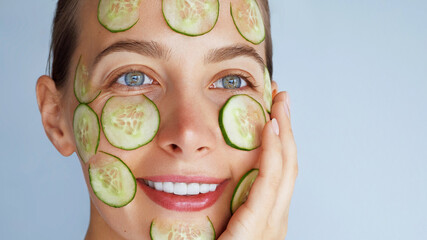 Cucumber facial skin detox mask. Beauty portrait of young woman make daily skincare routine....