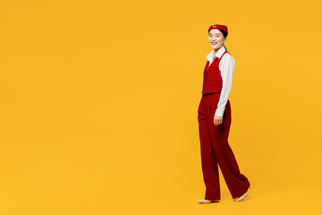 Full body side profile view young stewardess flight attendant woman of Asian ethnicity wear red...