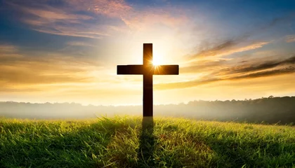 Zelfklevend Fotobehang silhouette christian cross on grass in sunrise background © Richard